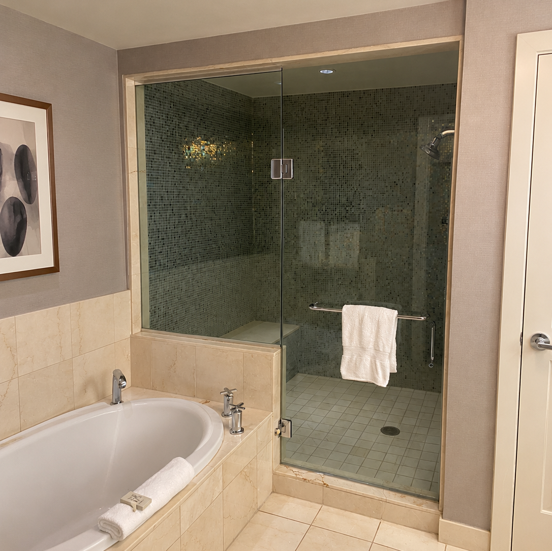 Frameless glass shower enclosure in a modern bathroom