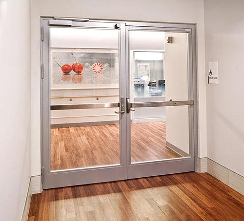 Fire-rated glass doors with labeled glazing panels