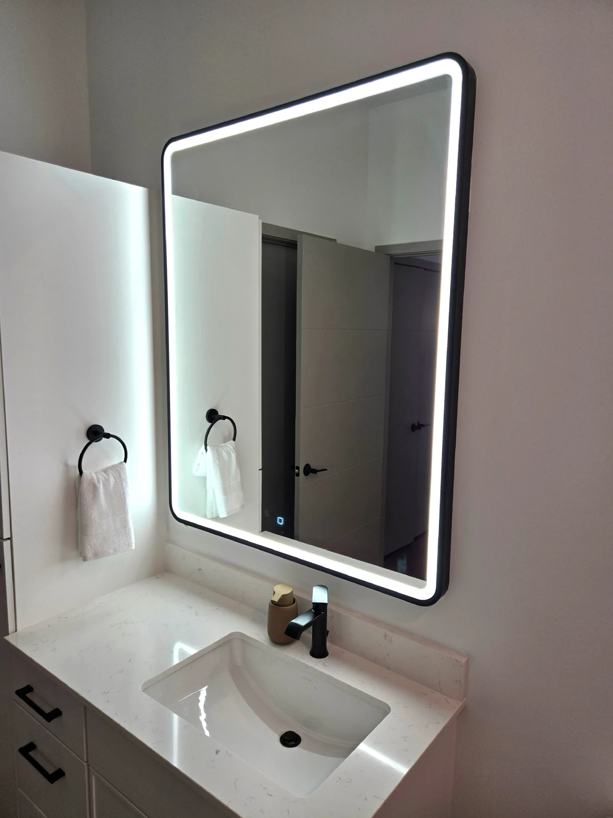 LED backlit bathroom mirror with integrated touch controls