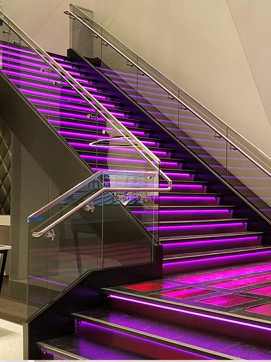 Illuminated glass staircase and railings at T-Mobile Las Vegas